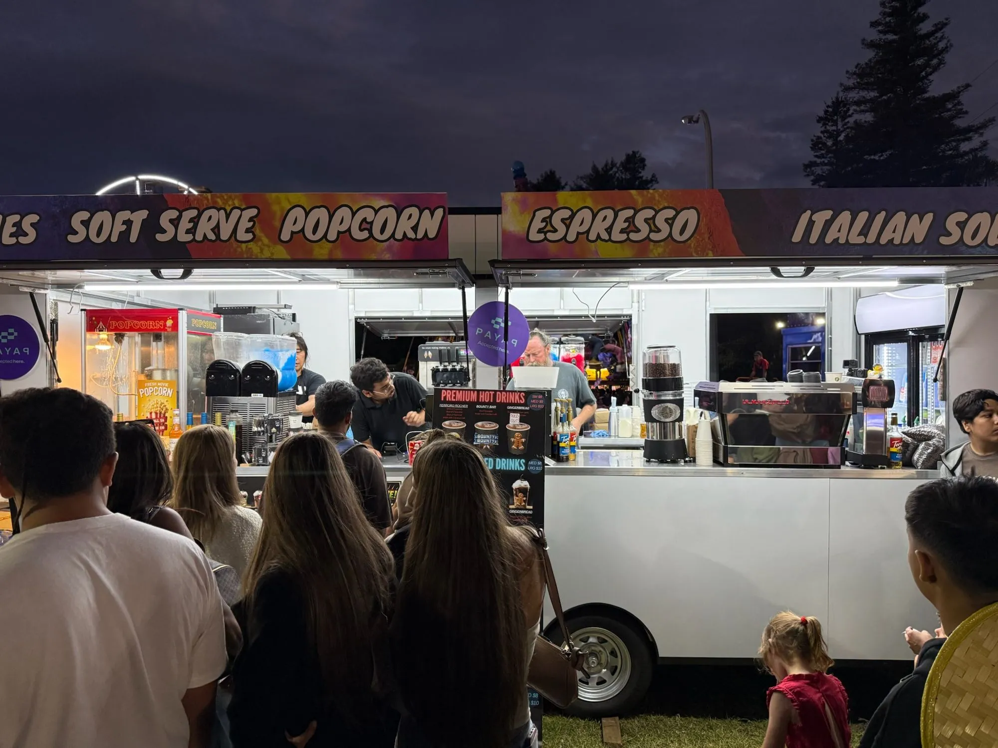 Headshot Coffee trailer serving a night-time festival crowd
