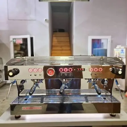 A commercial three-group espresso machine